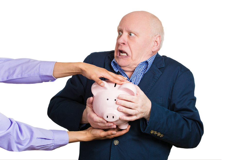 Older man, someone taking piggy bank.jpg